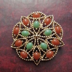 Sarah Coventry Gold Brooch with Red and Green Stones